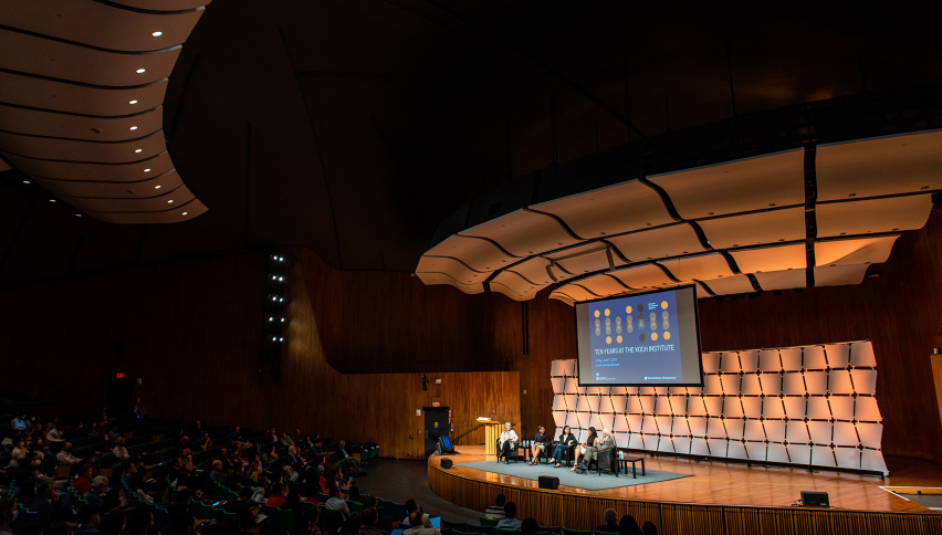 panel talk on stage at MIT Kresge Hall