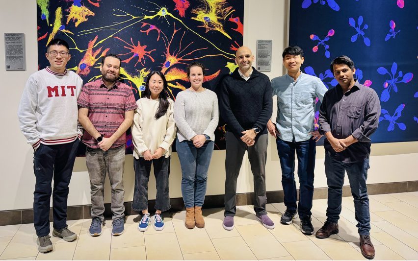 A group of scholars posing for a photo in the KI public galleries