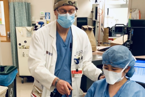 Yaffe conferring with a colleague at a hospital